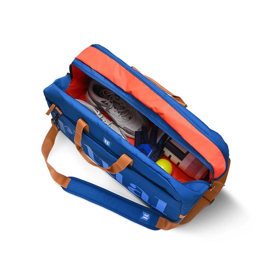 Ritual Calibre hockey duffle bag blue with items inside